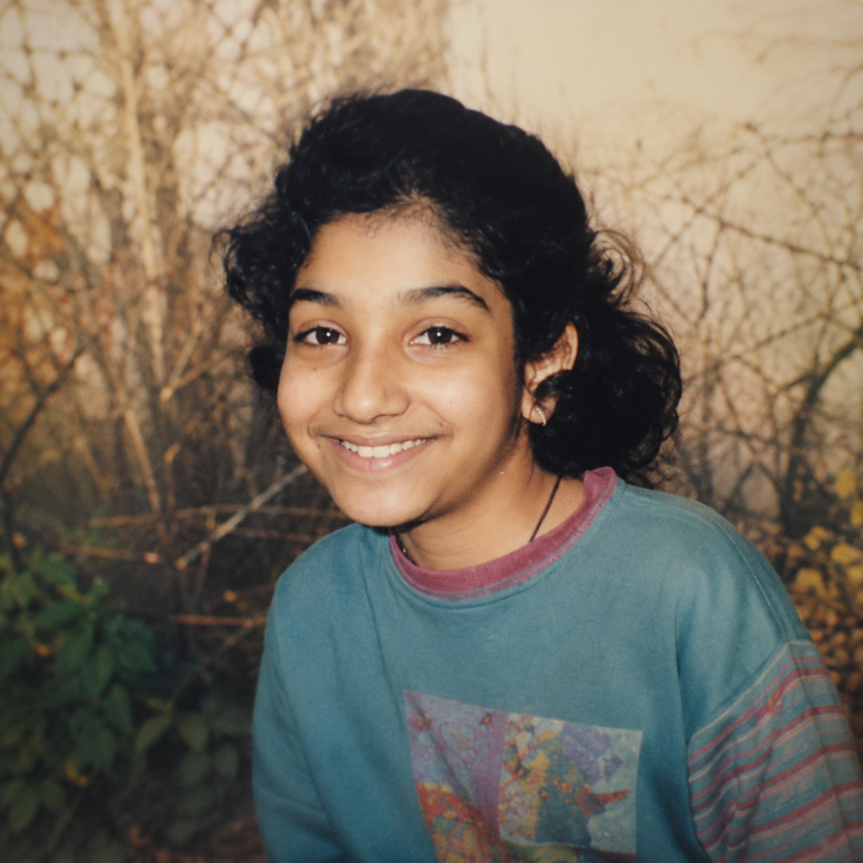 Young Bhargavi smiling outdoors