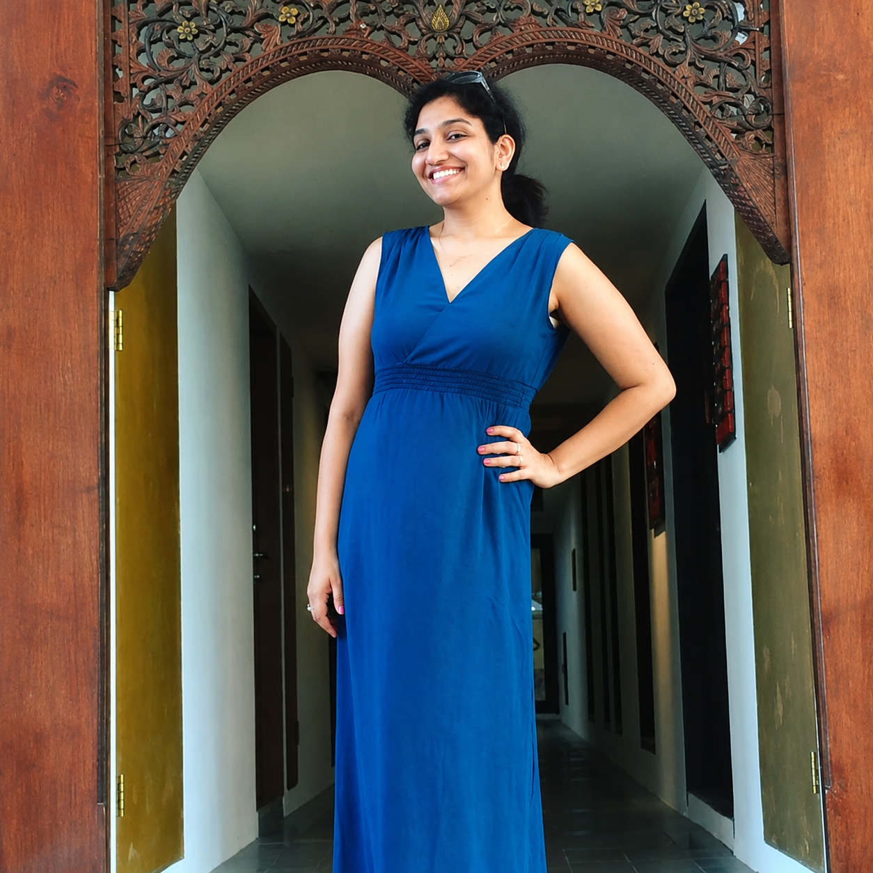 Bhargavi smiling in a blue dress